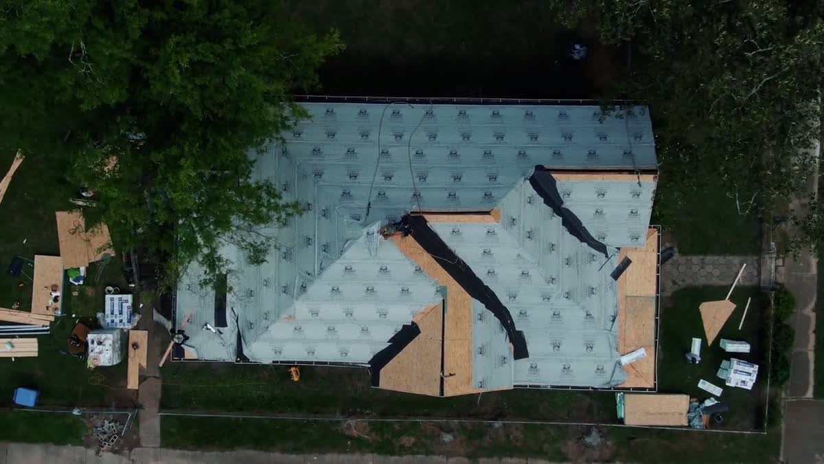 Aerial view of ice and water shield underlayment installed along roof valleys